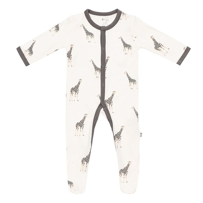 Kyte Baby infant snap footie with giraffes in charcoal brown on off-white ground. Snaps down front and legs with charcoal brown trim along snaps and at collar and sleeve cuffs.