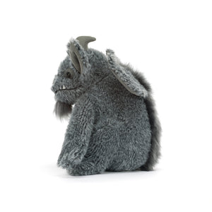 A gray plush monster toy with textured fur, small horns, and large floppy ears, shown from the side on a clean white background.