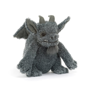 A plush gray dragon toy with small horns, large pointed ears, and a soft furry texture, photographed against a clean white background.