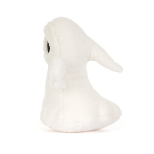 A small white plush bunny toy with a single black eye, photographed against a seamless white background.