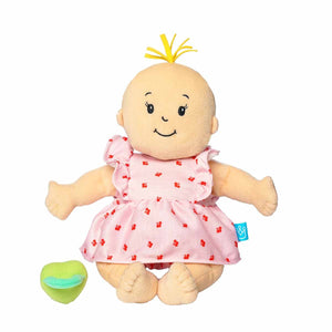 Plush Baby Stella Peach doll with blonde tuft of hair wearing a pink dress and bloomers with cherries print on it. Green magnetic pacifier is beside doll. Doll is 15 inches and is sitting facing forwards.