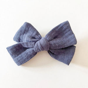 Bohemian Babies. Navy muslin bow on an alligator hair clip