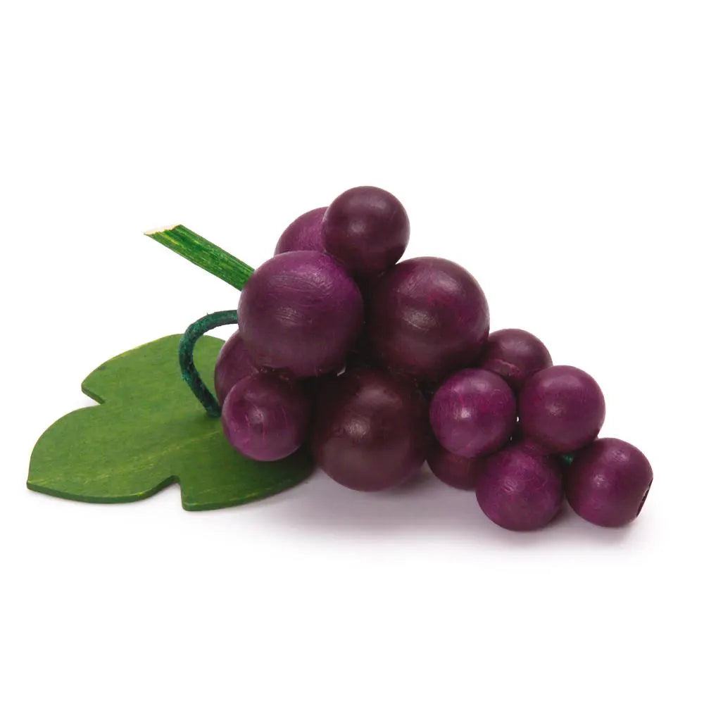 Purple wooden grapes with a green leaf on a white background