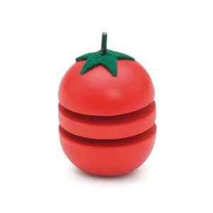 Red tomato-shaped wooden toy with a green stem on a white background