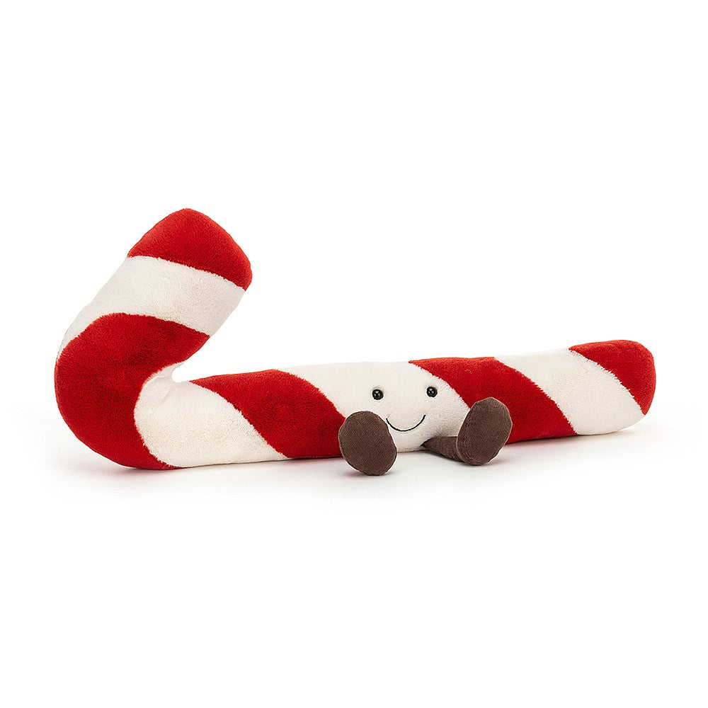Plush red and white candy cane with brown corduroy feet and smiling face,