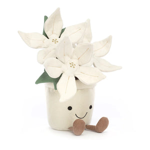 Plush cream and gold poinsettia plant with brown corduroy feet and smiling face.