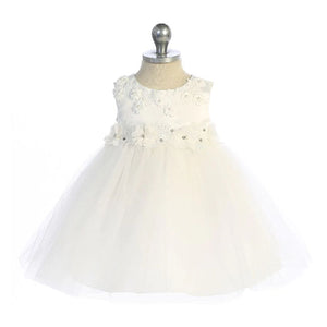 Ivory empire waist baby dress with fabric flower appliques at waist and neckline. Tulle skirt.