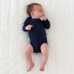 Kyte Baby Long Sleeve Bodysuit in Navy