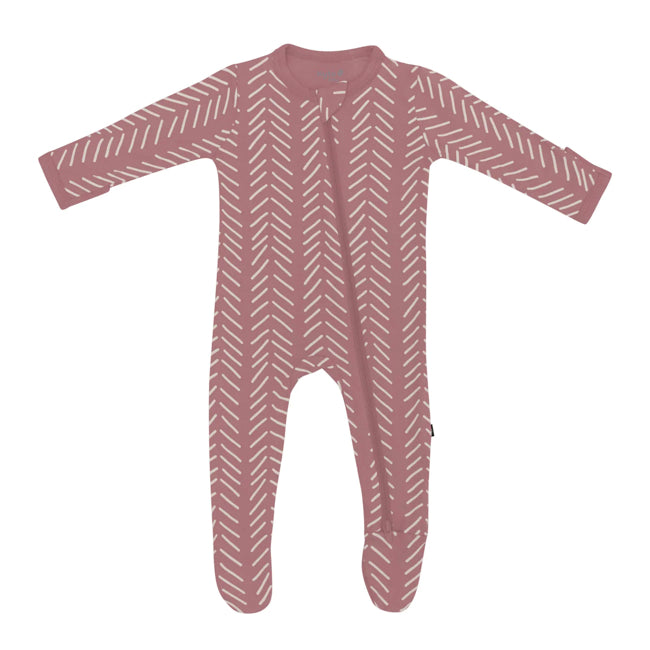 Kyte Baby infant zippered footie with Herringbone print in cloud on a Dusty Rose ground. Zipper down front and one leg with protective zip guard at neck.  Solid Dusty Rose trim at collar and sleeve cuffs.