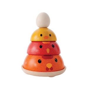 Wooden stacking toy shaped like a chick on a white background
