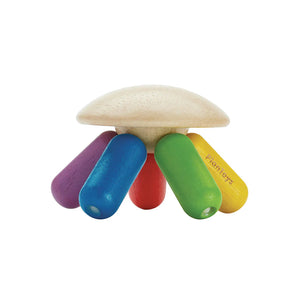 Colorful wooden toy jellyfish on a white background