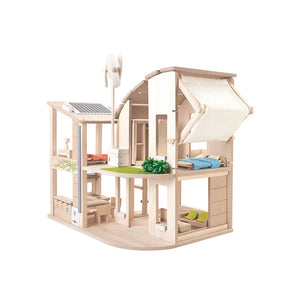 Wooden dollhouse with furniture on a white background