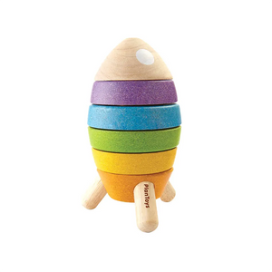 Colorful composite rubberwood stacking toy rocket on a white background