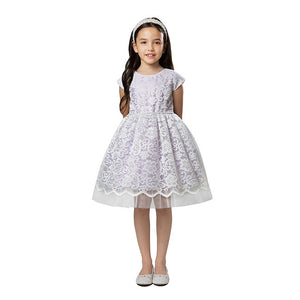 Lifestyle pic of dark haired girl wearing lavender special occasion dress with lace overlay
