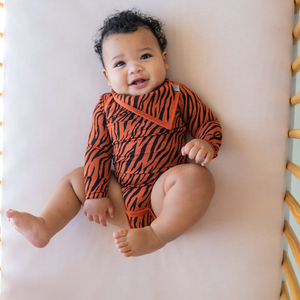 kyte baby printed long sleeve bodysuit - rust tiger